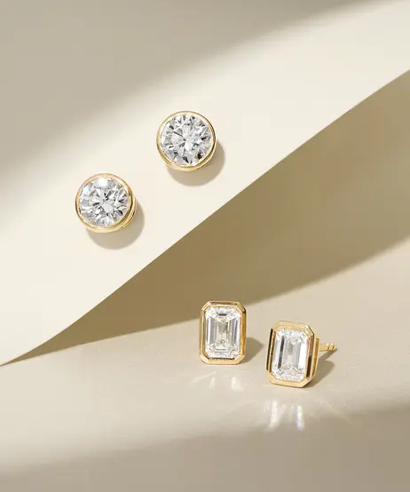 2_pairs_of_bezel_set_diamond_earrings