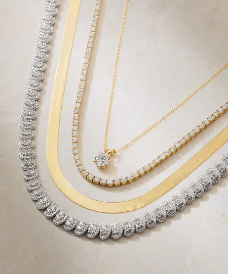 A_diamond_pendant,_and_tennis_necklace_stacked